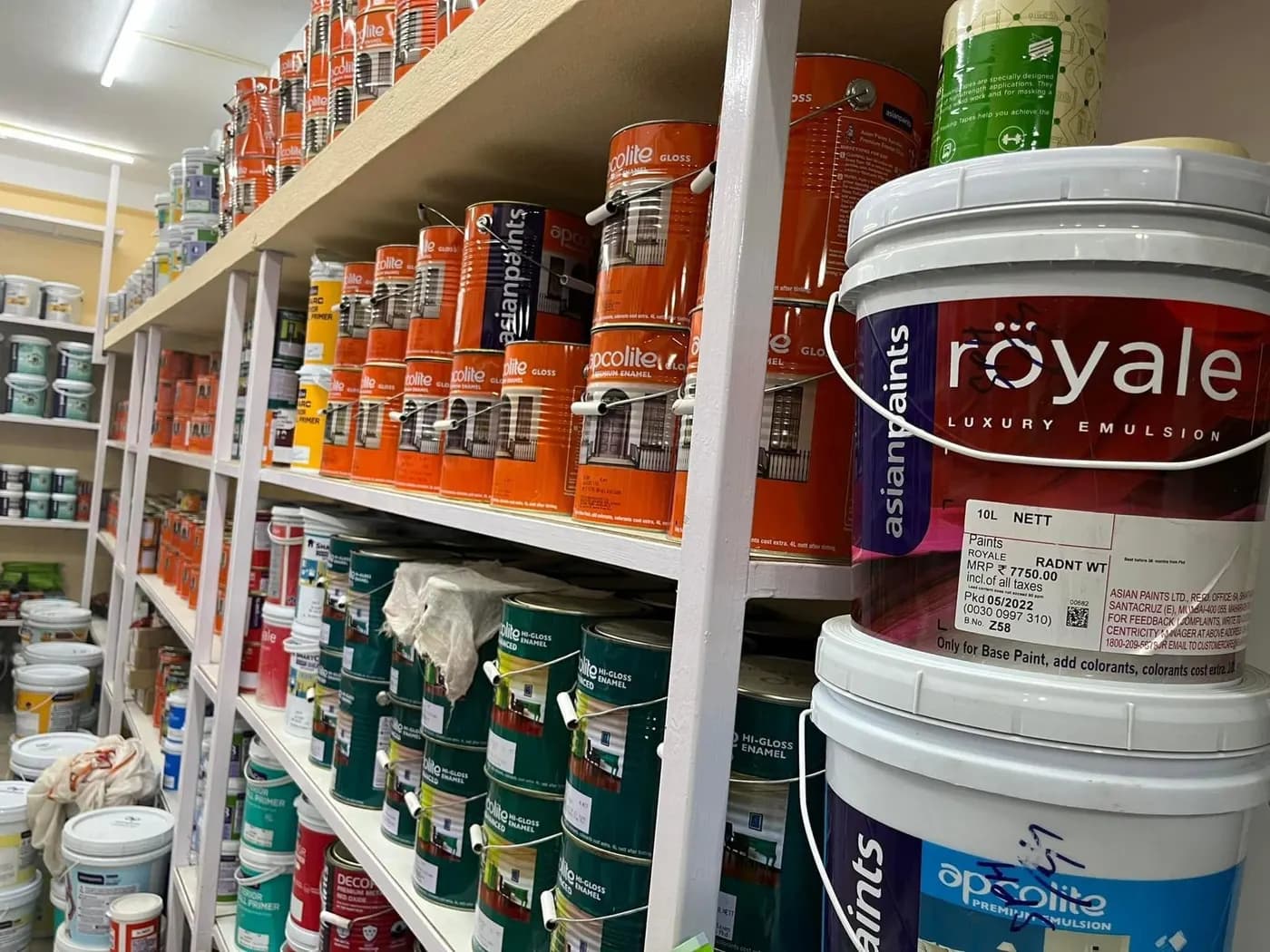 Aisle of Asian Paints pails inside the Skypaint store
